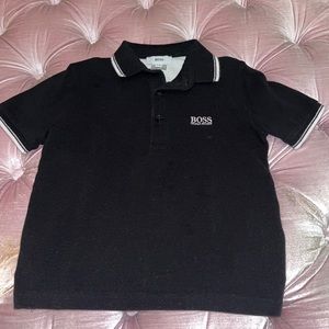 Hugo Boss boys polo t-shirt. Size 4. Black with white trim. Very Good condition